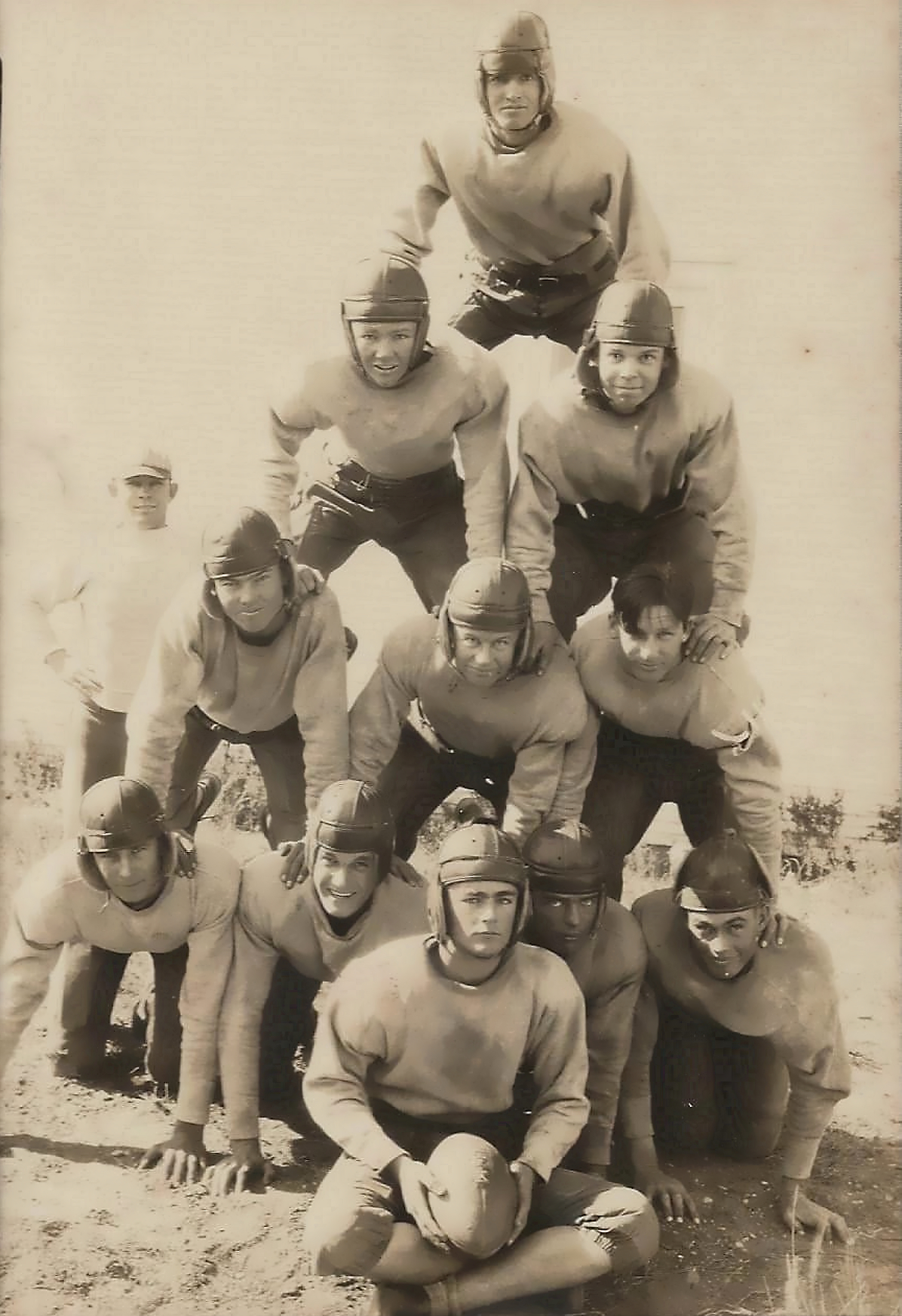 The Matador Texas High School football built a tower of athletes for this amazing photo in 1918