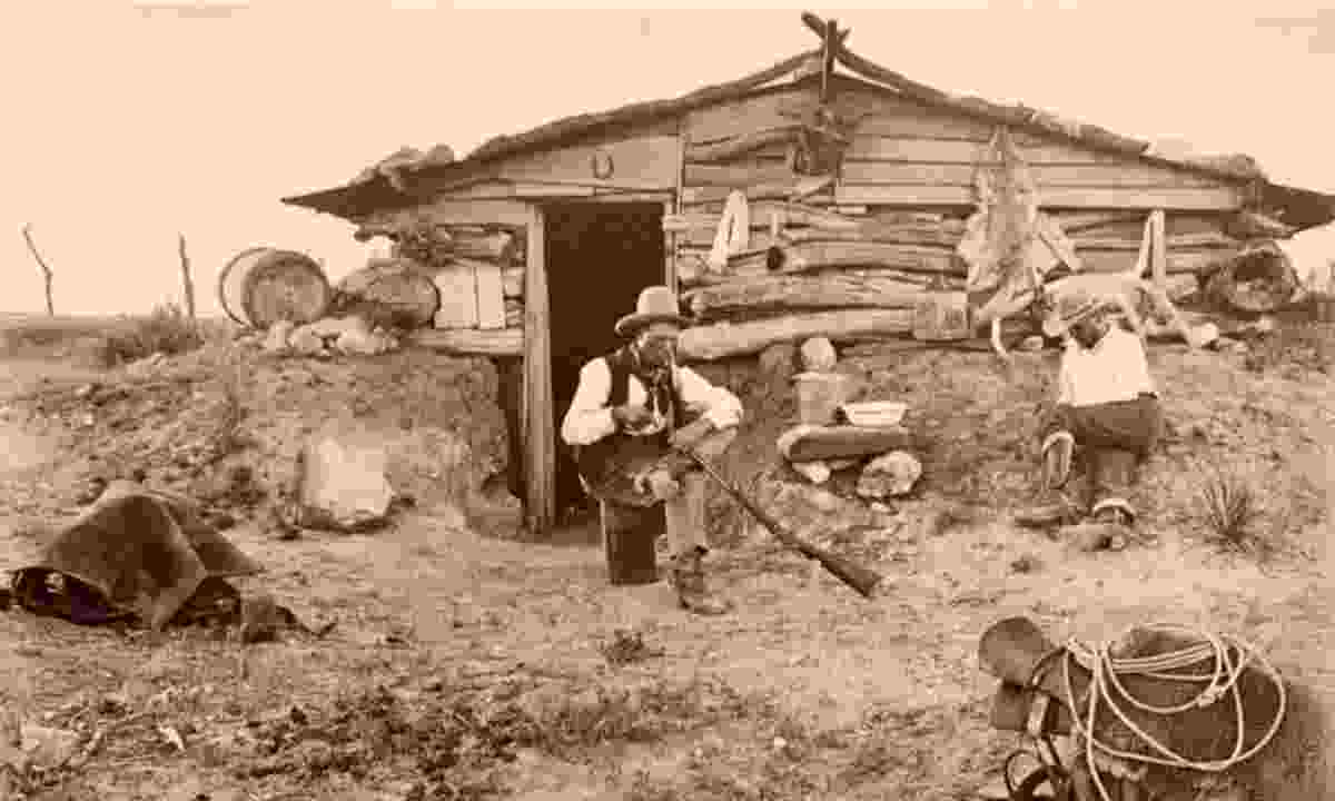 Cleaning Rifle at a Matador Ranch Line Camp
