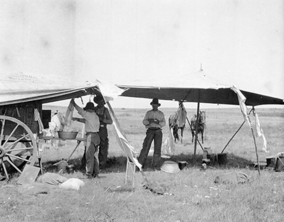 Cowboys Washing Clothes