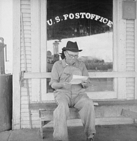 Man in front of Carey Texas Post Office in 1937