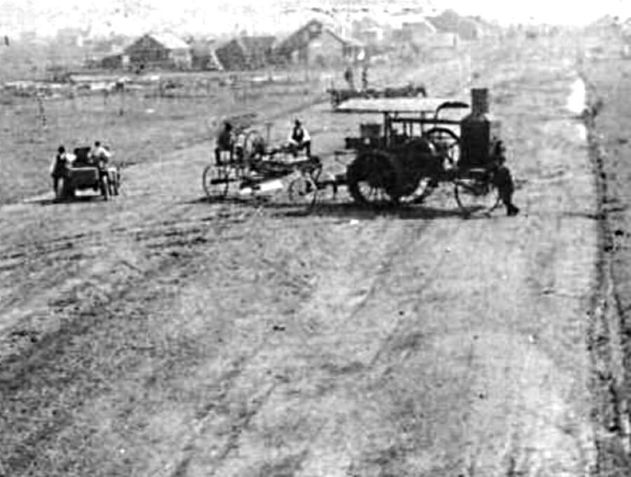 Early Tractor pulls Road Grader in Gray County Texas