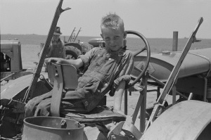 Sitting on Dad's tractor 1939